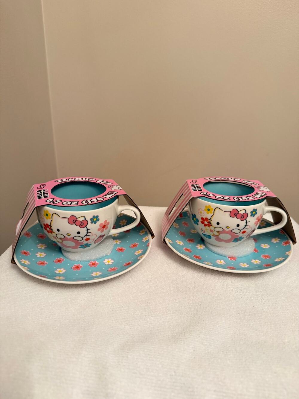 A Pair Sanrio Hello Kitty Floral Ceramic Teacup and Saucer Set NEW 7-ounce.